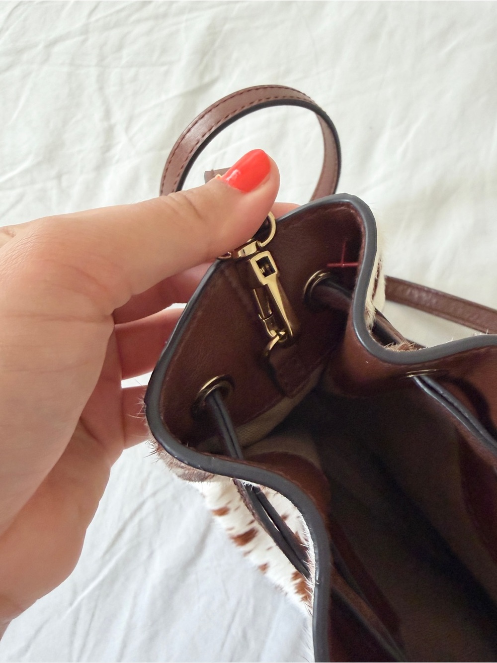 The Mini Drawstring Crossbody Bucket Bag Cow Print - Picture 9 of 11
